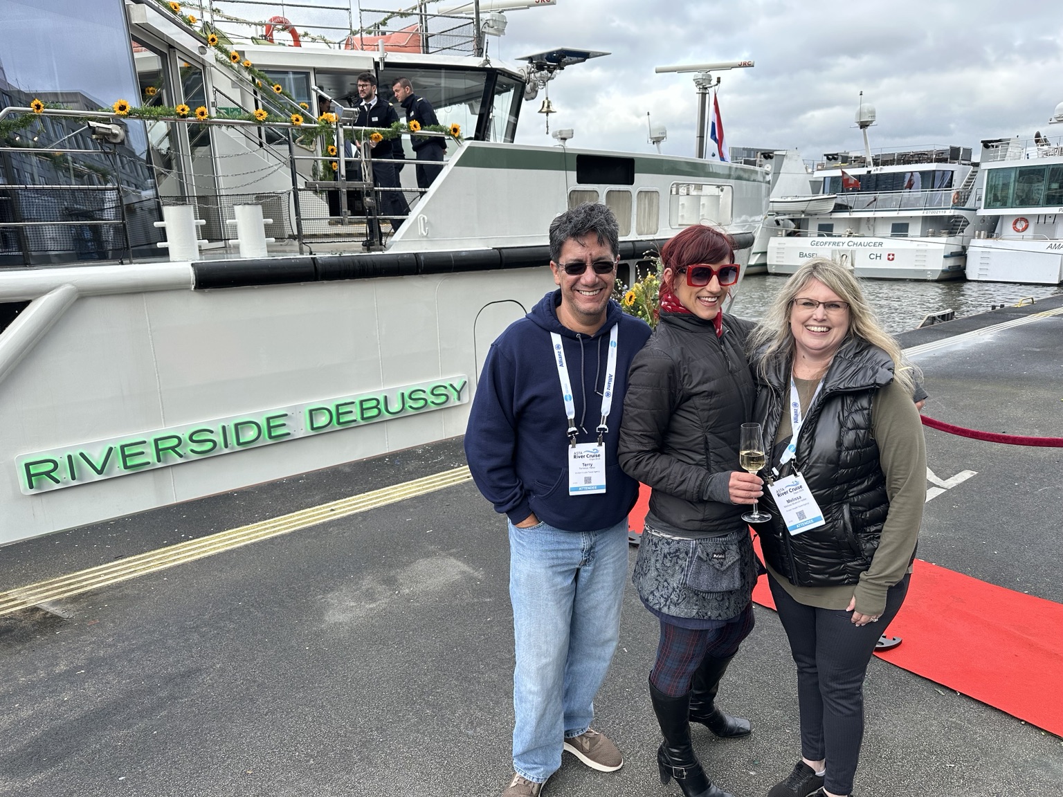 Melissa Yetter with colleagues beside the Riverside Debussy river cruise ship