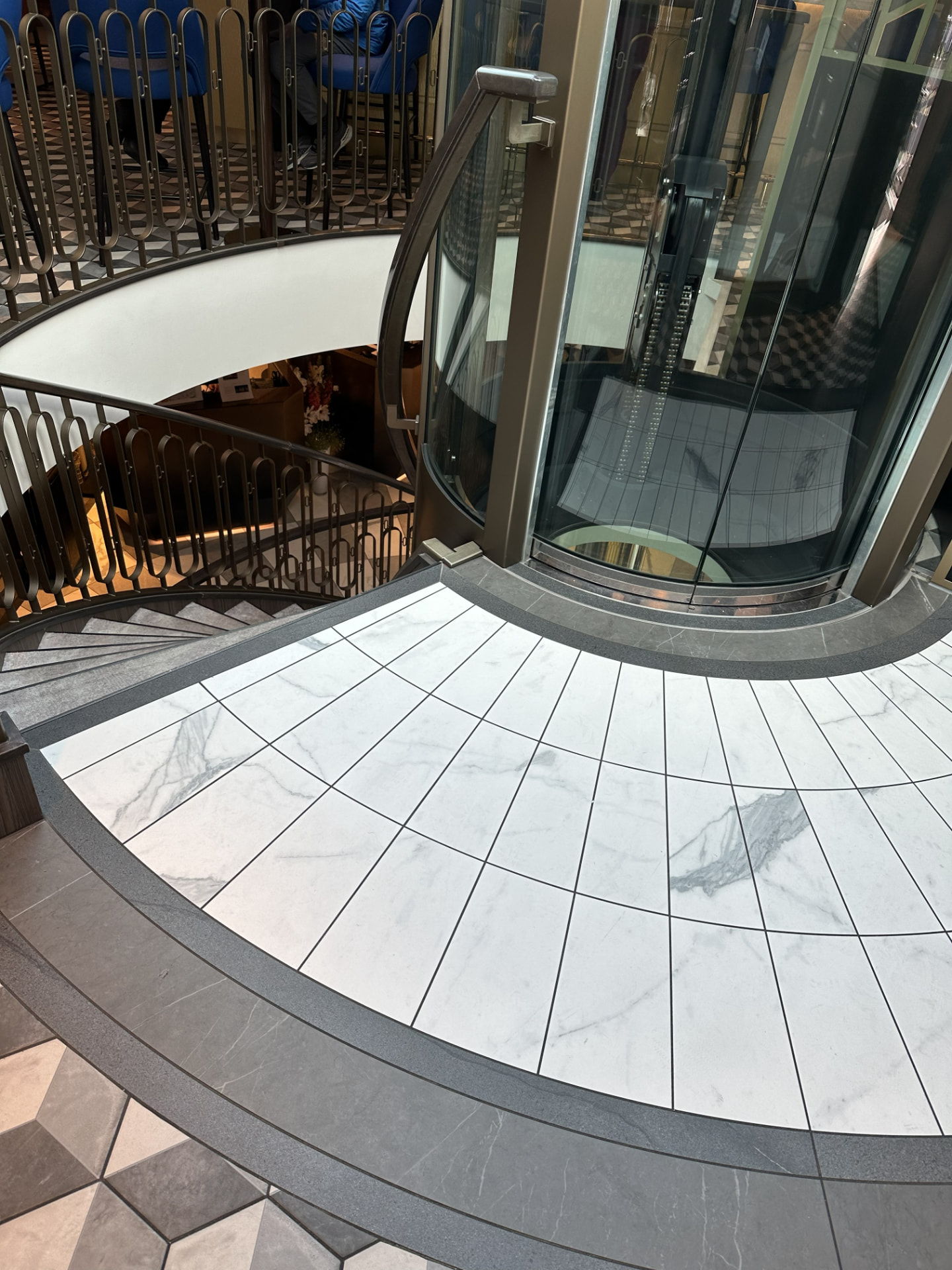 The grand staircase and glass elevator