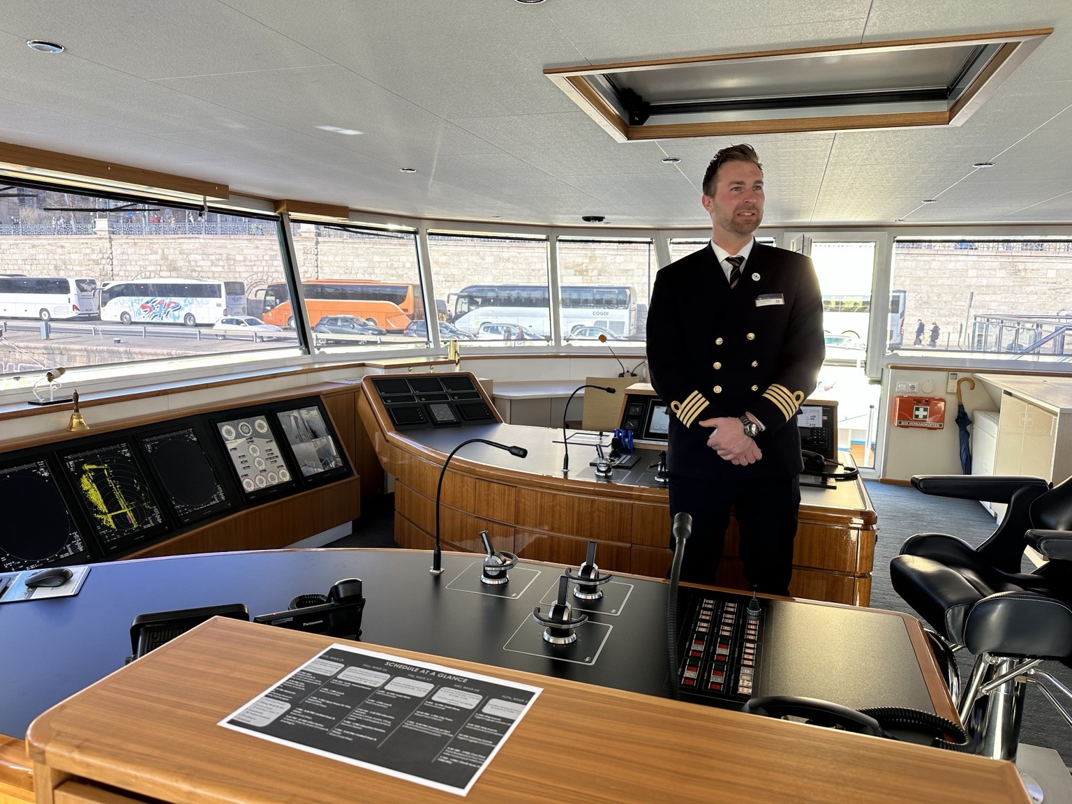 Captain on the bridge of a European river cruise ship