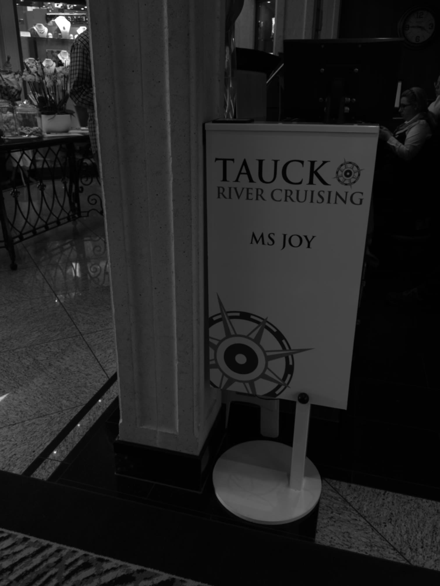 Tauck River Cruising ms Joy welcome sign standing in the ship's lobby during the ASTA River Cruise Expo