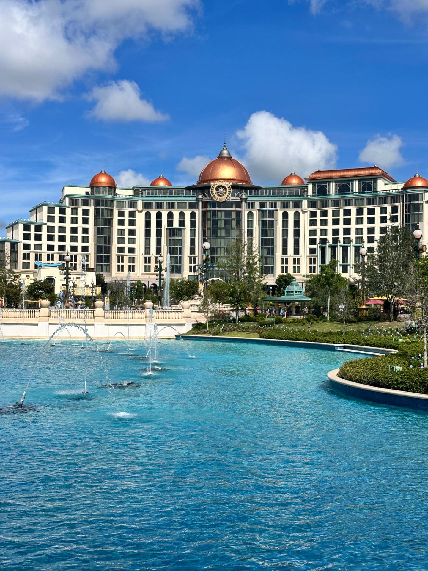 Universal Helios Grand Hotel with copper domes overlooking fountains and a pool at Epic Universe
