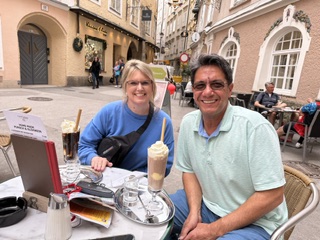 Melissa and Terry Yetter enjoying iced coffees at an outdoor cafe in Salzburg's old town